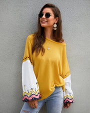 Model wearing the sweater with casual jeans